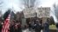 FILE - Protesters gather outside Minnesota Gov. Tim Walz's official residence in St. Paul, Minn., April 17, 2020, to call on him to loosen stay-at-home restrictions.