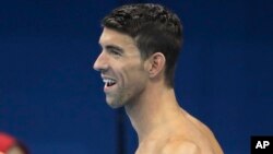 United States' Michael Phelps smiles as he arrives for a swimming training session at the 2016 Summer Olympics in Rio de Janeiro, Brazil, Aug. 2, 2016.
