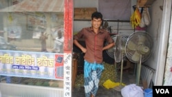 Former garment worker Liton Mia was injured in the collapse of Rana Plaza but today he owns a shop that rents out lights and equipment for weddings. (Amy Yee for VOA News)