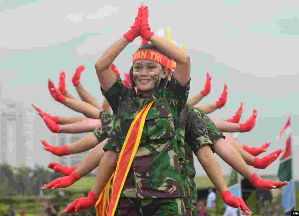 Female members of the Indonesian armed forces perform as they mark Kartini Day in Jakarta. The event is held to enhance integrity and solidarity for Indonesian women commemorating the birth of Raden Ajeng Kartini, an Indonesian heroine born in 1879, a pioneer in the emancipation of Indonesian women.