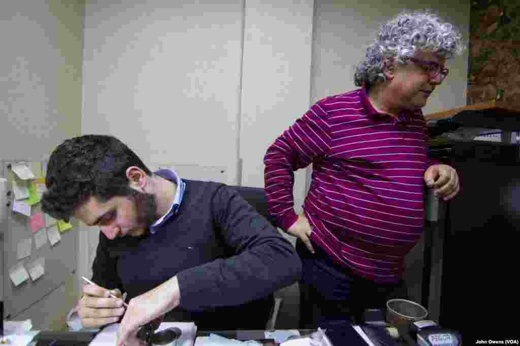 Khajag Barsoumian, left, and his father, Sarkis, work in the family business, in Beirut, Lebanon, Feb. 26, 2016. Unlike many of the younger Armenian generation, 19-year-old Khajag has decided to follow in his father's footsteps.