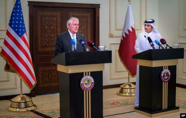 U.S. Secretary of State Rex Tillerson, left, and the Qatari Minister of Foreign Affairs Sheikh Mohammed bin Abdulrahman Al Thani take part in a press conference in Doha, Qatar, July 11, 2017.