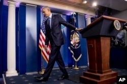 President Barack Obama leaves a news conference in the Brady press briefing room at the White House in Washington, Dec. 16, 2016.