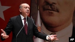 Turkey's President Recep Tayyip Erdogan addresses his ruling party members in Ankara, Turkey, Jan. 26, 2018.
