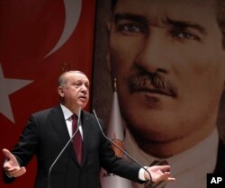 Turkey's President Recep Tayyip Erdogan addresses his ruling party members in Ankara, Turkey, Jan. 26, 2018.