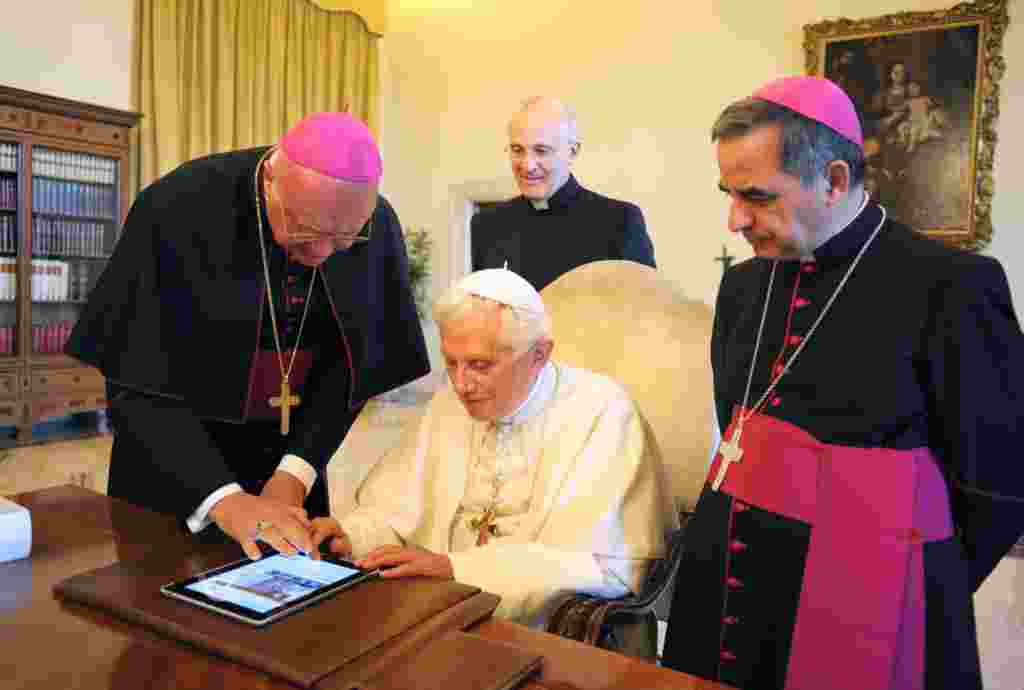 June 28: Pope Benedict XVI checks the new Vatican web portal on an iPad. The Pope will launch the site, a news portal that aggregates the Vatican's media, on Wednesday, the 60th anniversary of his ordination into the priesthood. (Reuters)
