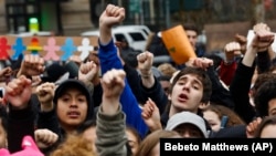 FILE - In New York's Foley Square, students protest against President Donald Trump's executive order banning travel from seven Muslim-majority nations.