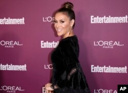 FILE - Alyssa Milano arrives at the 69th Primetime Emmy Awards Entertainment Weekly pre party at the Sunset Tower Hotel, Sept. 15, 2017, in Los Angeles.