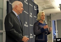 Cindy McCain, right, introduces her husband, Sen. John McCain, R-Ariz., to a group of female supporters in Scottsdale, Ariz., Oct. 12, 2016. Sen. McCain announced a new coalition of female supporters at the event, just days after concerns about comments presidential candidate Donald Trump made about women prompted him to pull his endorsement.