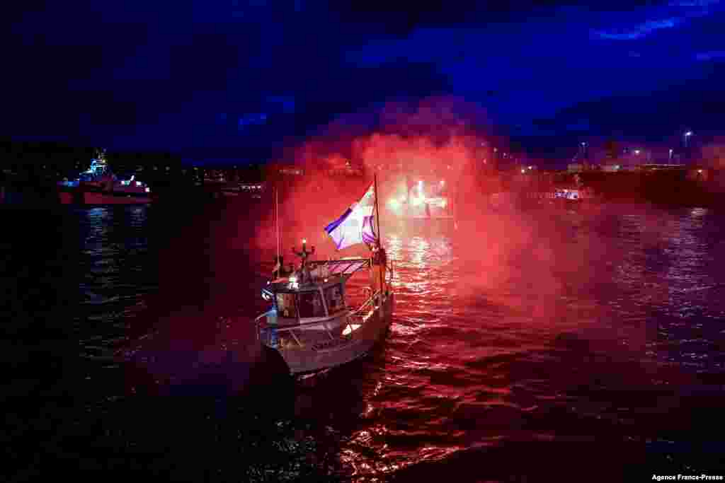 French fishing boats block the entrance to the port of Saint-Malo as fishermen protest post-Brexit fishing rights.