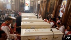 Coffins of the slain Coptic Christians are seen during their funeral service at Church of Great Martyr Prince Tadros, in Minya, Egypt, Nov. 3, 2018.