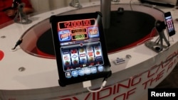 San Manuel Indian Bingo and Casino's online gambling app "Code Red" is demonstrated in the exhibitors room at the GiGse online gaming convention in San Francisco, April 24, 2012. 