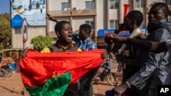 Protesters take to the streets of Burkina Faso's capital, Ouagadougou, Jan. 22, 2022.
