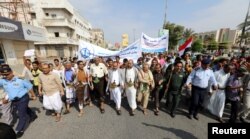 FILE - Pro-Houthi protesters demonstrate to demand the opening of humanitarian corridors in Hodeida, Yemen, Dec. 31, 2018.