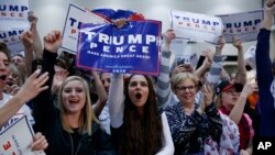 Supporters of Republican presidential candidate Donald Trump cheer during an early-morning campaign rally, November 8, Electon Day, in Michigan. (AP Photo/ Evan Vucci)