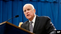 FILE - California Gov. Jerry Brown responds to a question at a news conference in Sacramento, Jan. 10, 2018. On March 30, 2018, Brown pardoned five ex-convicts facing deportation, including two whose families fled the Khmer Rouge regime in Cambodia four d