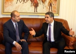 Bulgarian President Rosen Plevneliev, right, speaks to President-elect Rumen Radev in Sofia, Bulgaria, Nov. 14, 2016. Radev takes over in January.