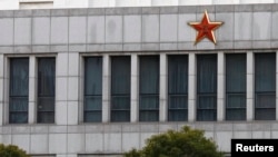 FILE - Part of the building of 'Unit 61398', a secretive Chinese military unit believed to be involved in hacking is seen in the outskirts of Shanghai, China was named the world leader in cyber espionage in a recent report.