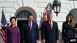 US President Donald Trump and First Lady Melania Trump greet China's President Xi Jinping and his wife Peng Liyuan at the South Portico of the White House during an arrival ceremony as they are invited for tea in Washington, DC, on September 25, 2026.