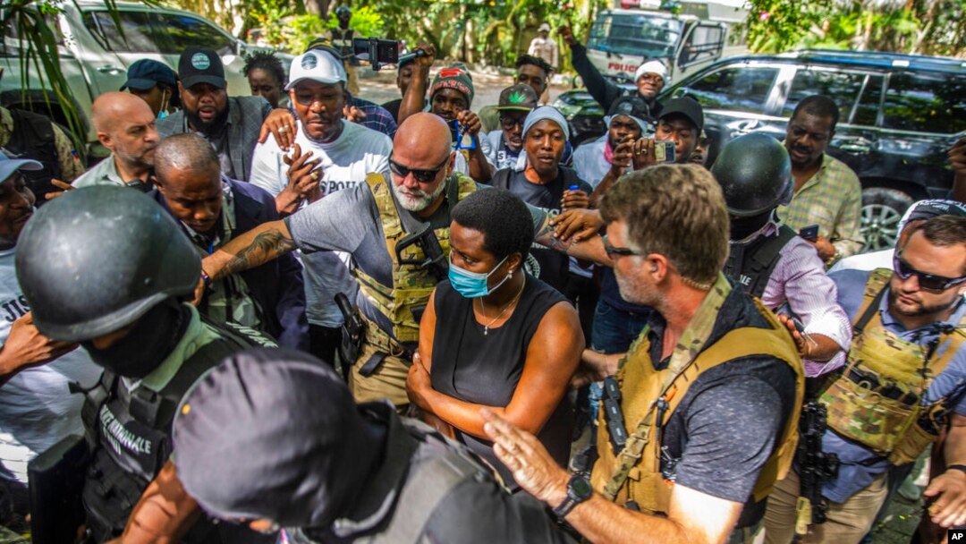 Martine Moise, center, the widow of slain President Jovenel Moise, arrives at the courthouse to give testimony in the investigation into the assassination of her husband, in Port-au-Prince, Haiti, Oct. 6, 2021.