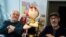 Author Jean-Yves Ferri and illustrator Didier Conrad pose with a figure of the character Adrenaline during an interview about their new Asterix comic book "La Fille De Vercingetorix" in Vanves near Paris, Oct. 22, 2019.