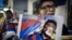 Rights group activists stage a protest to raise awareness on the human rights situation in Tibet and the closure of the territory to foreign visitors, outside the Chinese liaison office in Hong Kong on June 20, 2012. 