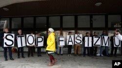 Protesters hold a banner outside the Supreme Court in Bratislava, Slovakia, April 29, 2019.