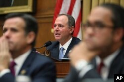 House Intelligence Committee Chairman Adam Schiff questions former special counsel Robert Mueller as he testifies before the committee on his report on Russian election interference, on Capitol Hill, in Washington, July 24, 2019.