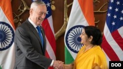 Indian Minister of External Affairs Sushma Swaraj shakes hands with U.S. Defense Secretary James Mattis before the start of the 2+2 meeting at the Ministry of External Affairs in New Delhi, Sept. 6, 2018. 