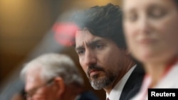 Canada's Prime Minister Justin Trudeau attends a news conference with government ministers on Parliament Hill in Ottawa, Ontario, Canada May 1, 2020.