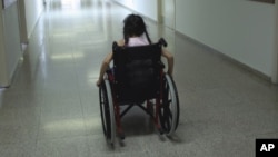 FILE - A U.N. report says disaster planning often neglects to take those with disabilities in mind.