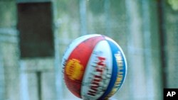 Former Harlem Globetrotters' star Curley Neal does some of his fancy ball-handling, Aug. 3, 1993, in New York.