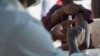 A Nigerian health official prepares to administer an mpox vaccination at Federal Medical Center in Abuja, Nigeria, Nov. 18, 2024. 