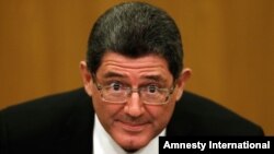 Brazil’s new Finance Minister Joaquim Levy listens to guests attending his swearing in ceremony at the Brazilian Central Bank, in Brasilia, Jan. 5, 2015. 