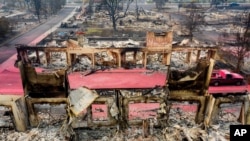 Facades stand among rubble at the Parkview Townhomes in Talent, Oregon, Sept. 16, 2020, following the Almeda Fire.