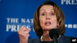 FILE - House Minority Leader Nancy Pelosi of Calif., gestures as she speaks during a news conference at the National Press Club in Washington, Feb. 27, 2017.