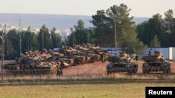 Turkish tanks positioned at a military base near the town of Suruc along the Syrian border, Sanliurfa province, Nov. 15, 2012.