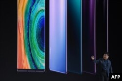 FILE - Richard Yu, head of Huawei's consumer business group, speaks on stage during a presentation to reveal Huawei's latest smartphones Mate 30 and Mate 30 Pro in Munich, Germany, Sept. 19, 2019.