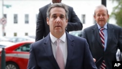 FILE - Michael Cohen, President Donald Trump's personal attorney, arrives on Capitol Hill in Washington. Cohen's office and hotel room were searched by agents of the Federal Bureau of Investigation (FBI).