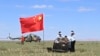 In this photo released by Xinhua News Agency, workers access the returned capsule of the Chang'e 6 probe in Siziwang Banner, northern China's Inner Mongolia Autonomous Region on June 25, 2024.