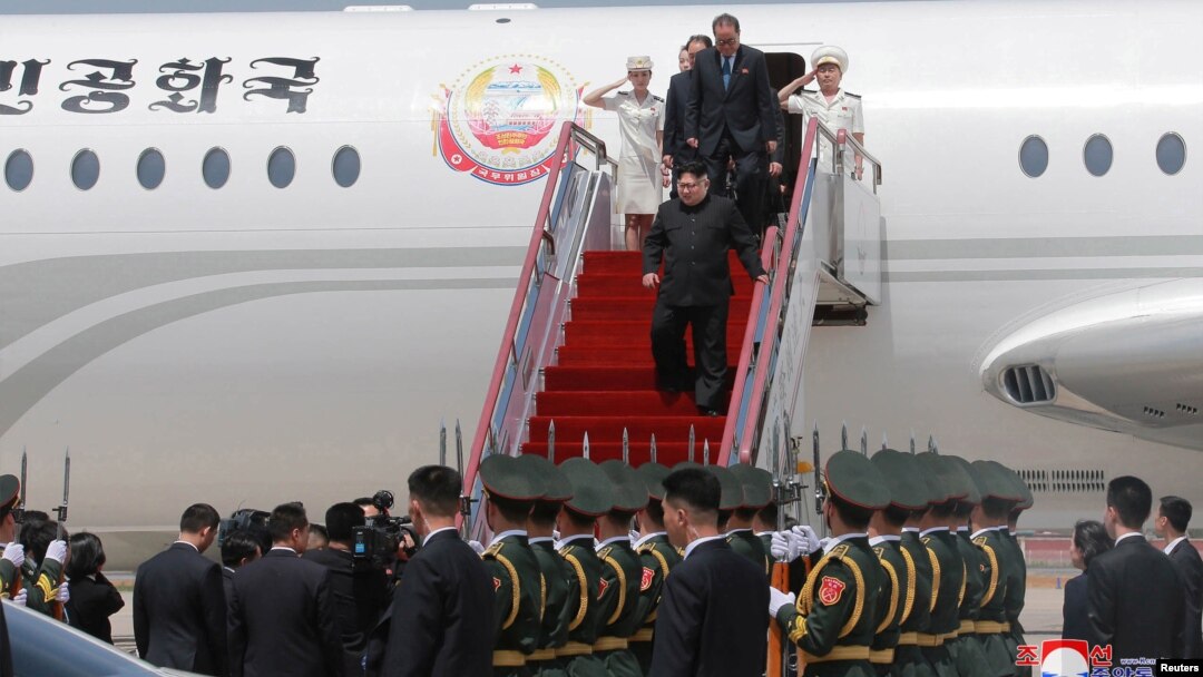 North Korean leader Kim Jong Un walks down from his airplane as he arrives for a visit in Dalian, China in this undated photo released on May 9, 2018 by North Korea's Korean Central News Agency (KCNA). 
