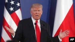 U.S. President Donald Trump gestures while answering a question during a joint news conference with Poland's President Andrzej Duda, in Warsaw, Poland, July 6, 2017. 