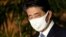 Former Japan's Prime Minister Shinzo Abe wears a face mask in August 2020, in Tokyo, shortly before he stepped down.