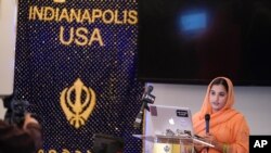 Aasees Kaur, legal client and community services manager of the Sikh Coalition reads a statement to the shooting at a FedEx facility at the Sikh Satsang of Indianapolis, April 17, 2021.