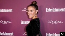 FILE - Alyssa Milano arrives at the 69th Primetime Emmy Awards Entertainment Weekly pre party at the Sunset Tower Hotel, Sept. 15, 2017, in Los Angeles. 