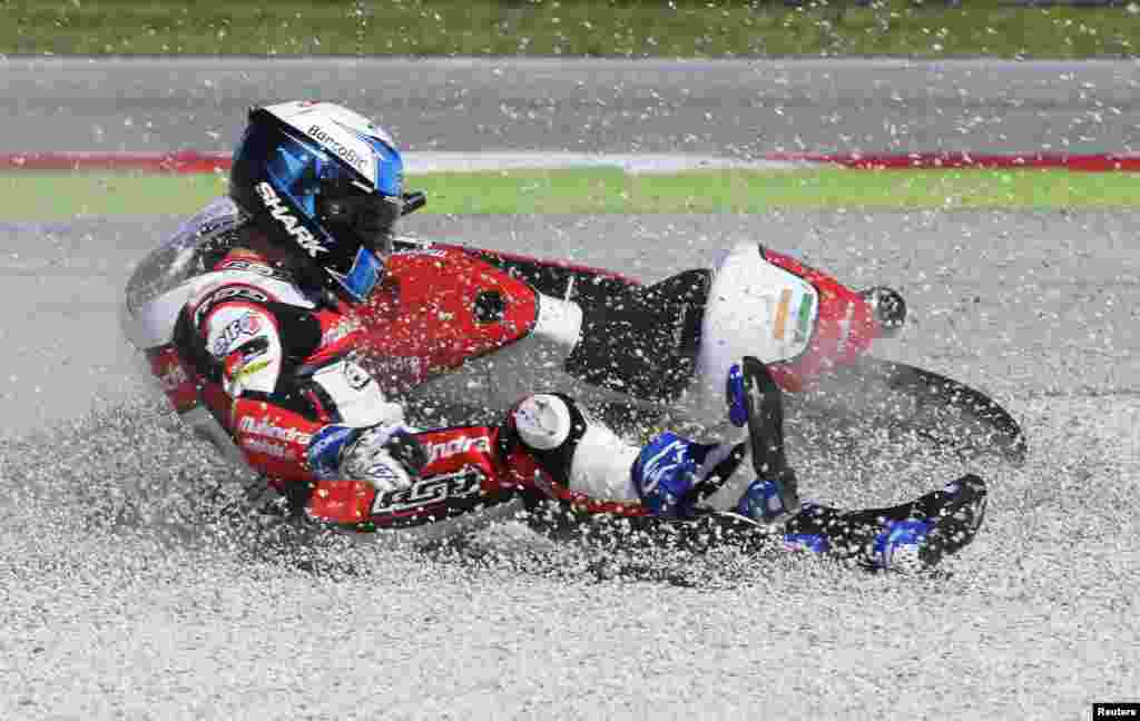 Mahindra Moto3 rider Miguel Oliveira of Portugal crashes during the San Marino Grand Prix in Misano Adriatico circuit in central Italy.