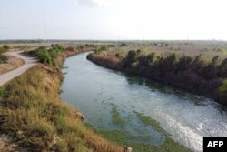 The Rio Grande divides the cities of Brownsville, Texas, right, and Matamoros, Tamaulipas, Mexico, on March 16, 2021.