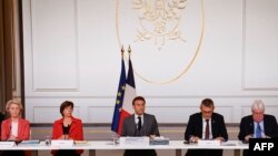 French President Emmanuel Macron is joined by diplomats Ursula von der Leyen, Catherine Colonna, Philippe Lazzarini and Martin Griffiths during a conference for civilians in Gaza, at the Elysee Presidential Palace, Nov. 9, 2023.