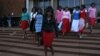 Some of Gumbura's wife outside the magistrates courts in Harare.