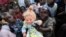 A Congolese girl, displaced by recent fighting in North Kivu, holds a doll at the child friendly space (CFS) within Mugunga III camp for the internally displaced people near Goma, eastern Democratic Republic of Congo.